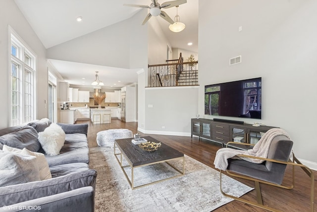 410 W 2nd St, Elmhurst, IL 60126 - living area featuring high vaulted ceiling, dark wood finished floors, a ceiling fan, baseboards, and visible vents