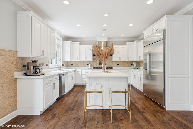 410 W 2nd St, Elmhurst, IL 60126 - kitchen featuring a center island, a sink, appliances with stainless steel finishes, and white cabinets