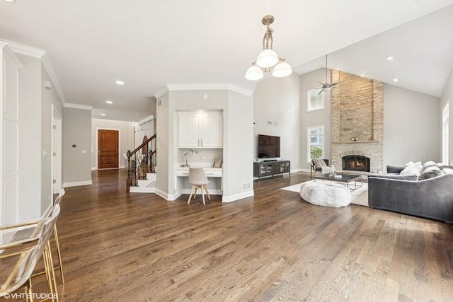 410 W 2nd St, Elmhurst, IL 60126 - living room with a stone fireplace, stairs, ceiling fan, and wood finished floors