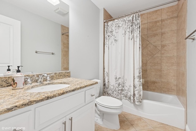 410 W 2nd St, Elmhurst, IL 60126 - bathroom featuring vanity, shower / bath combo with shower curtain, tile patterned floors, toilet, and visible vents