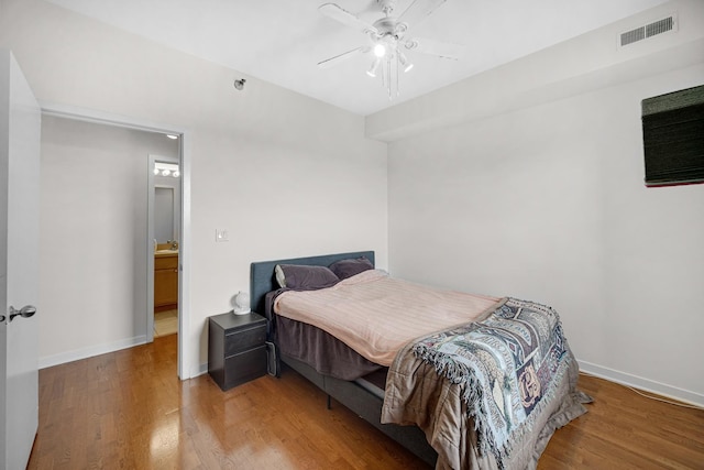 4350 N Broadway St Unit 810, Chicago, IL 60613 - bedroom featuring a ceiling fan, baseboards, visible vents, and wood finished floors