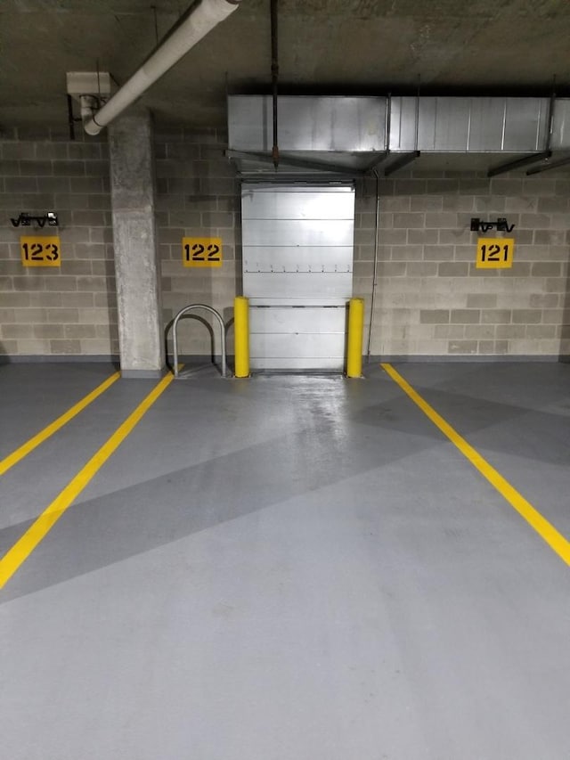 parking deck featuring concrete block wall