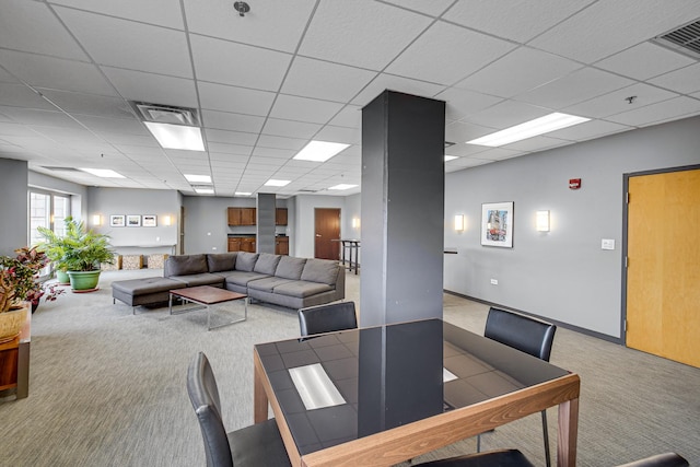 dining area featuring carpet flooring, visible vents, and a paneled ceiling