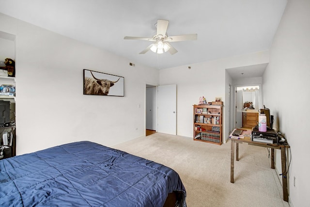 bedroom with carpet floors, a ceiling fan, and visible vents