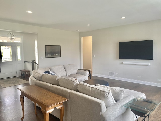living area featuring visible vents, recessed lighting, dark wood finished floors, a chandelier, and baseboards