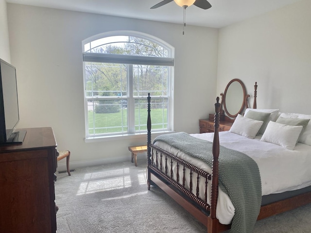 bedroom with baseboards, carpet flooring, and ceiling fan
