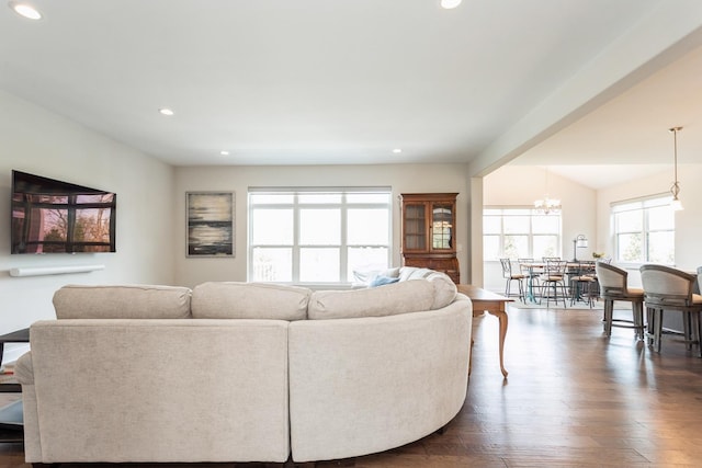 living room featuring an inviting chandelier, dark wood-style flooring, and recessed lighting
