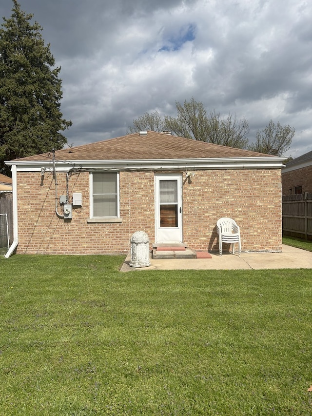 3506 Louis St, Franklin Park, IL 60131 - rear view of house with brick siding, a patio area, and roof with shingles