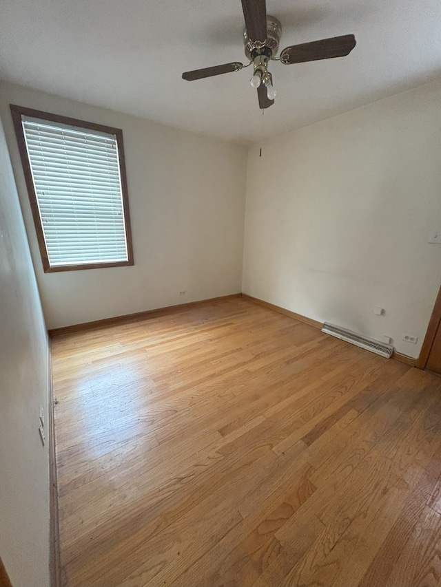 3506 Louis St, Franklin Park, IL 60131 - spare room featuring light wood-type flooring, ceiling fan, and baseboards