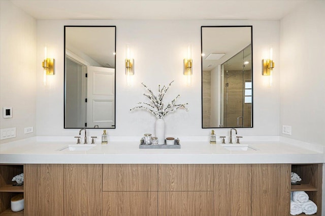 full bath with double vanity, a sink, and a shower with door