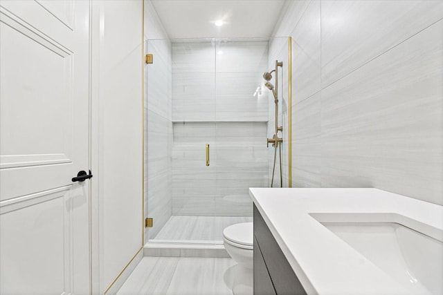 full bathroom with recessed lighting, vanity, a stall shower, and toilet