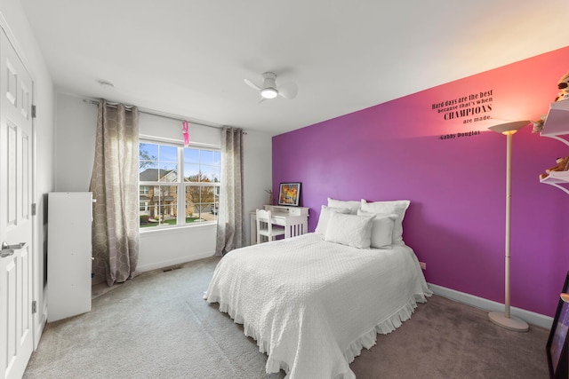 bedroom with baseboards, a ceiling fan, carpet, and visible vents