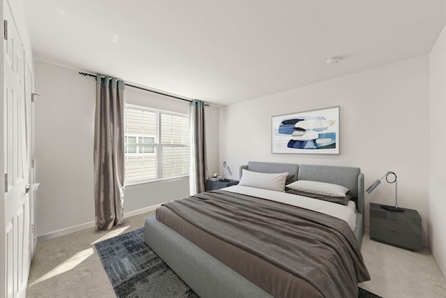 carpeted bedroom with baseboards