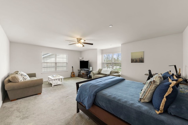 carpeted bedroom with a ceiling fan
