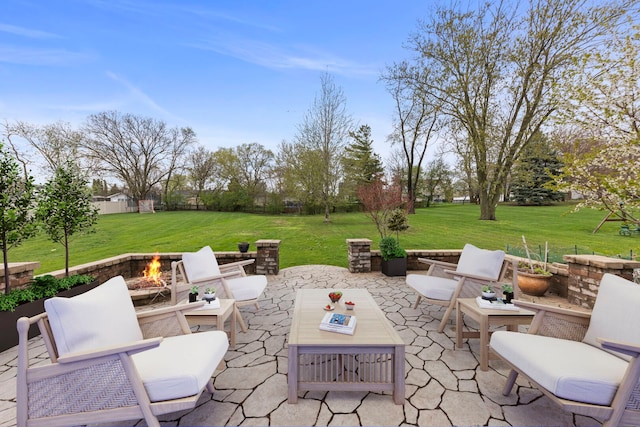 view of patio with an outdoor fire pit