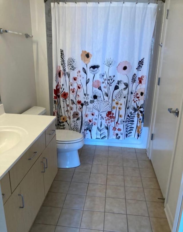 1740 Oak Ave Unit 307, Evanston, IL 60201 - full bathroom featuring toilet, tile patterned floors, a shower with shower curtain, and vanity