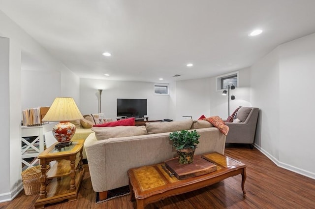 living area featuring wood finished floors, recessed lighting, and baseboards