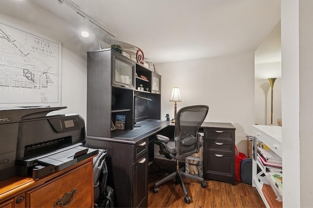 office area with rail lighting and wood finished floors