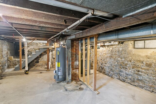 unfinished below grade area with water heater and stairs