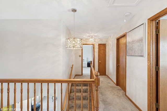 11330 Brigitte Ter, Orland Park, IL 60462 - hallway with light carpet, attic access, an upstairs landing, and baseboards