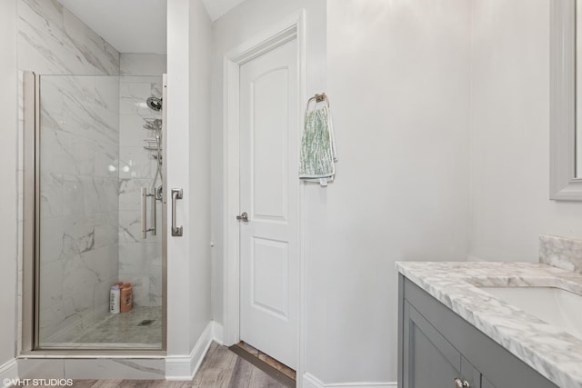 11330 Brigitte Ter, Orland Park, IL 60462 - full bath with a marble finish shower, baseboards, vanity, and wood finished floors
