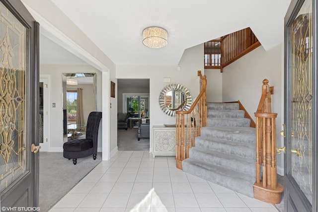 11330 Brigitte Ter, Orland Park, IL 60462 - foyer entrance featuring light colored carpet, stairway, baseboards, and light tile patterned floors