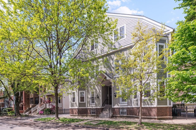view of front of home with stairs