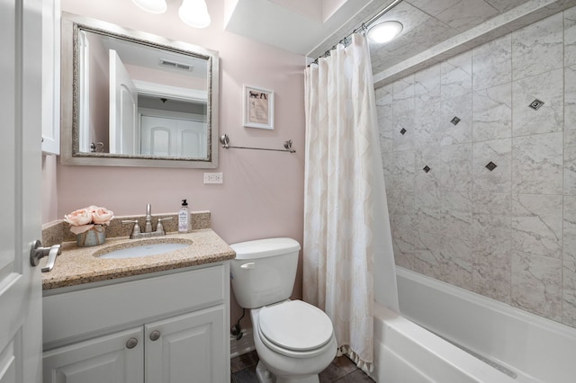 bathroom featuring toilet, vanity, and shower / tub combo