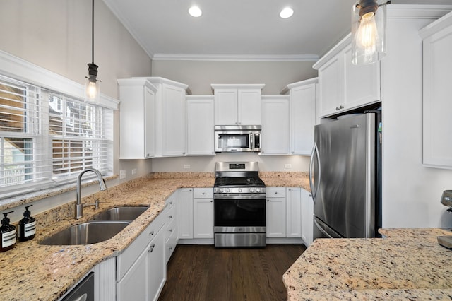 kitchen with appliances with stainless steel finishes, a sink, white cabinetry, dark wood finished floors, and recessed lighting