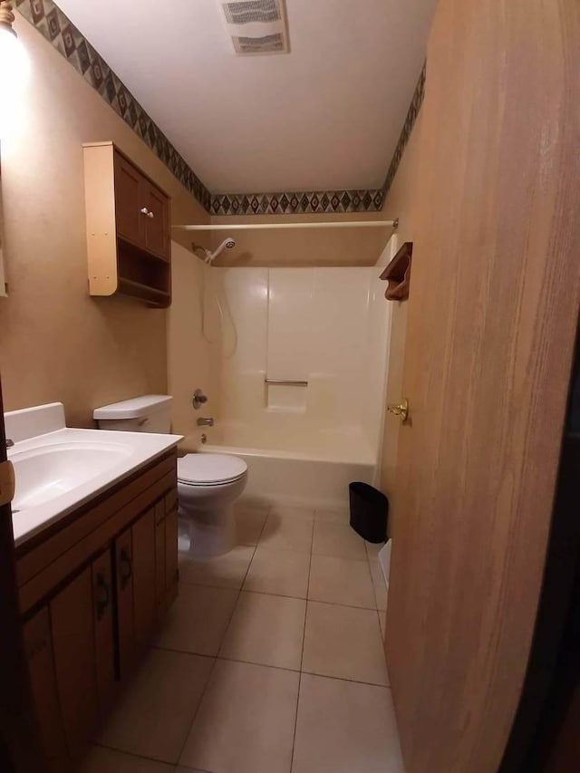 full bathroom featuring toilet, vanity, visible vents, tile patterned floors, and bathtub / shower combination