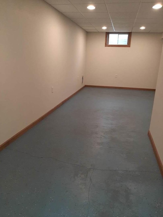 below grade area with baseboards and recessed lighting