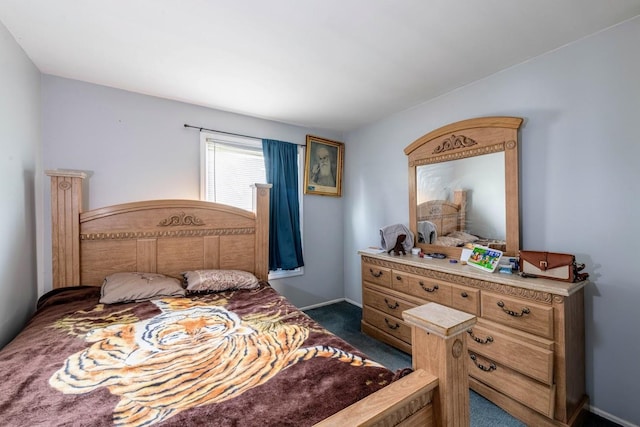 bedroom featuring dark carpet