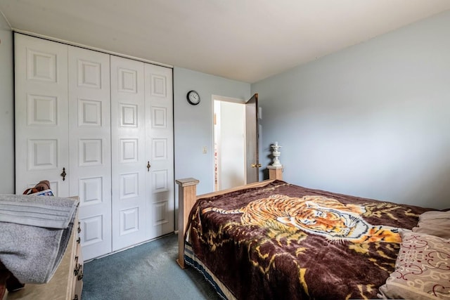 bedroom with carpet and a closet