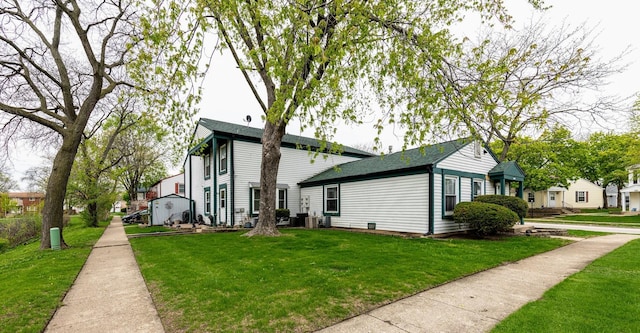 view of property exterior featuring a lawn