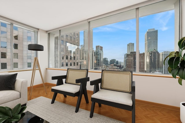 sunroom / solarium featuring a city view