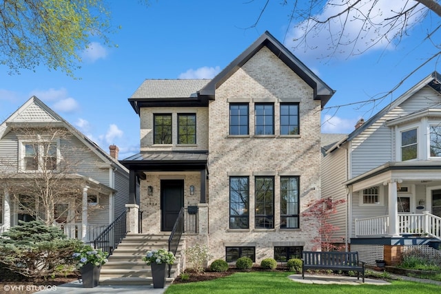 1934 W Patterson Ave, Chicago, IL 60613 - view of front facade featuring brick siding and a standing seam roof