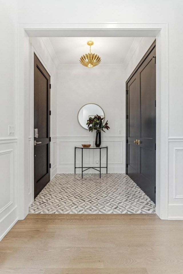 1934 W Patterson Ave, Chicago, IL 60613 - foyer with a decorative wall, wood finished floors, ornamental molding, and a wainscoted wall
