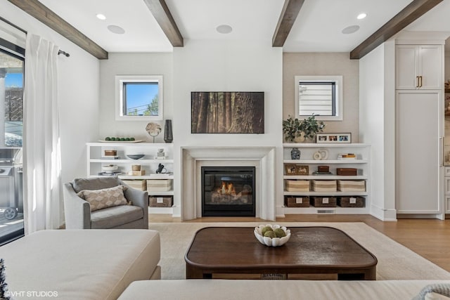 1934 W Patterson Ave, Chicago, IL 60613 - living room featuring beamed ceiling, wood finished floors, and a glass covered fireplace