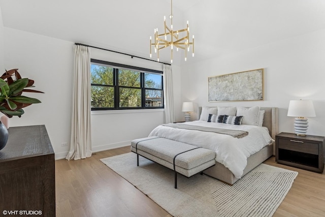 1934 W Patterson Ave, Chicago, IL 60613 - bedroom featuring a chandelier, light wood-style floors, and baseboards