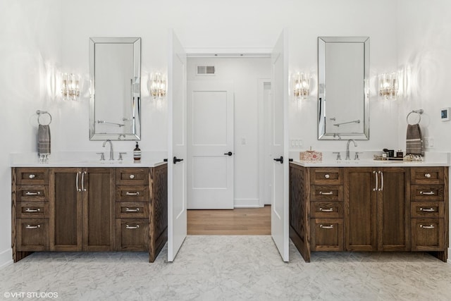 1934 W Patterson Ave, Chicago, IL 60613 - full bathroom featuring two vanities and baseboards