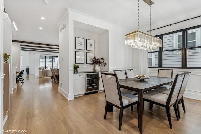 1934 W Patterson Ave, Chicago, IL 60613 - dining space with wine cooler, ornamental molding, a chandelier, light wood-style floors, and recessed lighting