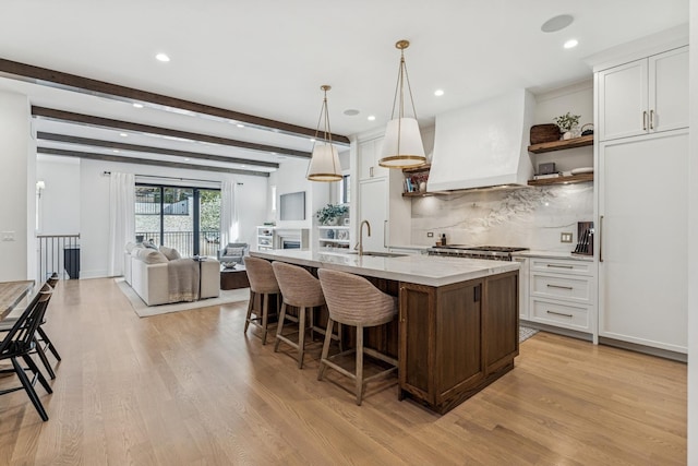 1934 W Patterson Ave, Chicago, IL 60613 - kitchen with open shelves, custom exhaust hood, decorative backsplash, light wood-style flooring, and recessed lighting