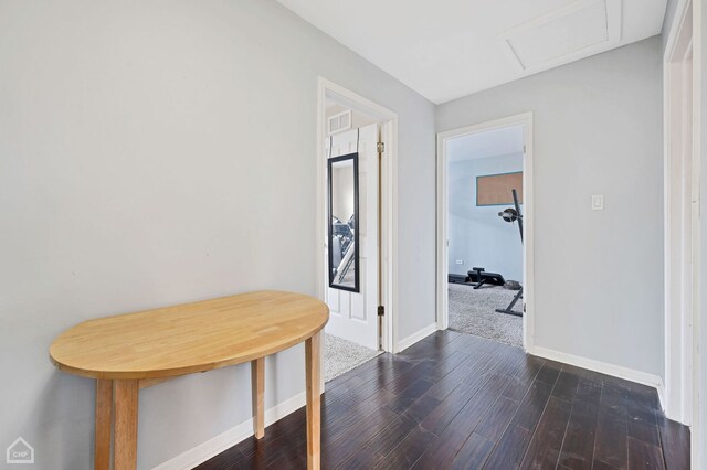 710 E 194th St, Glenwood, IL 60425 - hall featuring baseboards, visible vents, attic access, and dark wood-type flooring