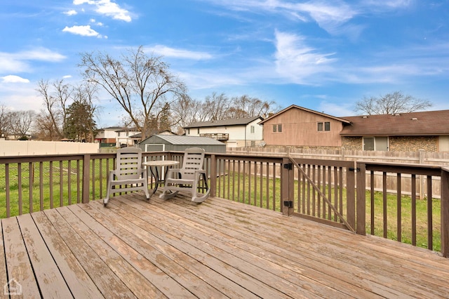 710 E 194th St, Glenwood, IL 60425 - wooden terrace with a lawn, a residential view, an outbuilding, a fenced backyard, and a storage unit