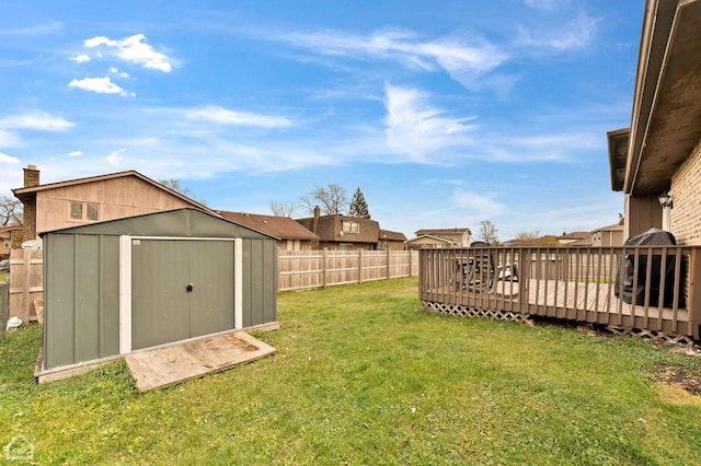 710 E 194th St, Glenwood, IL 60425 - view of yard featuring a storage shed, a deck, an outbuilding, and a fenced backyard