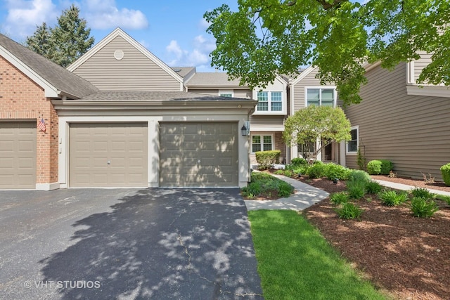 1537 Aberdeen Ct Unit 67, Naperville, IL 60564 - multi unit property with brick siding, roof with shingles, a garage, and aphalt driveway