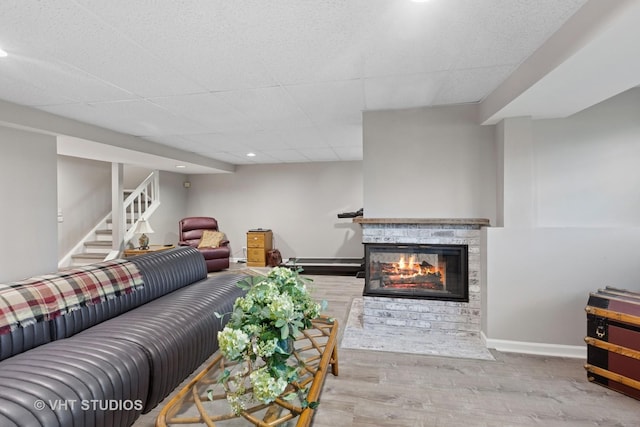 1537 Aberdeen Ct Unit 67, Naperville, IL 60564 - living area featuring wood finished floors, stairs, a multi sided fireplace, baseboards, and recessed lighting