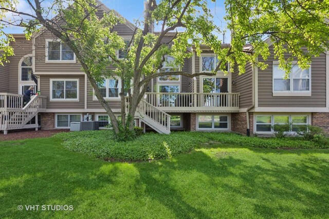 1537 Aberdeen Ct Unit 67, Naperville, IL 60564 - back of house featuring stairs, brick siding, and a lawn