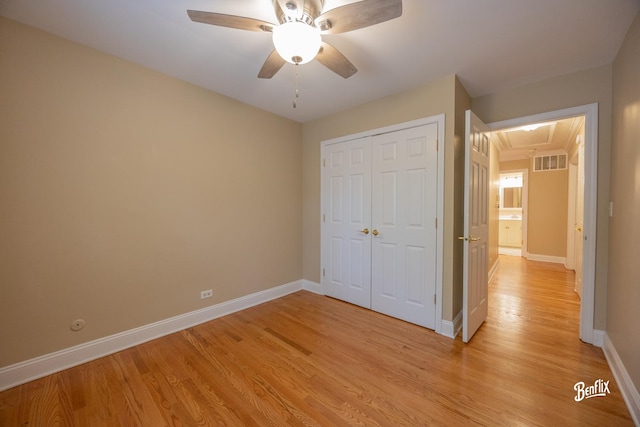 143 Midway Ln, Vernon Hills, IL 60061 - unfurnished bedroom with light wood-style floors, attic access, baseboards, visible vents, and a closet