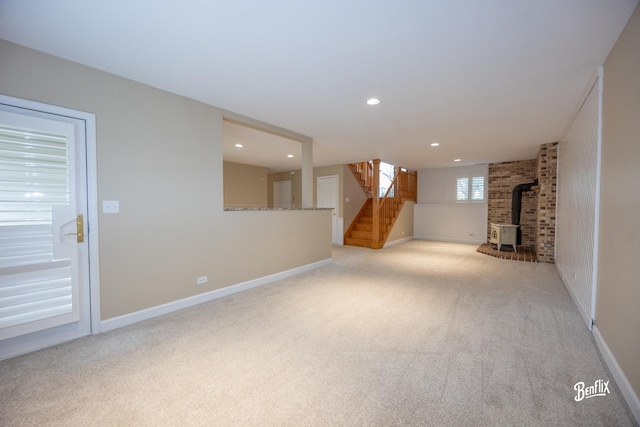 143 Midway Ln, Vernon Hills, IL 60061 - basement featuring recessed lighting, stairway, carpet, and a wood stove